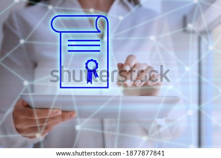 Online learning concept. Diploma icon on foreground and woman using tablet, closeup