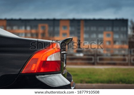 Spoiler on the trunk of modern car. Spoiler on the trunk of modern car. Silhuette of modern sedan car rear side Royalty-Free Stock Photo #1877910508