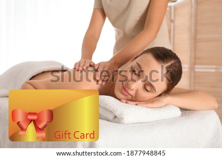 Spa salon gift card. Happy young woman having body scrubbing procedure 