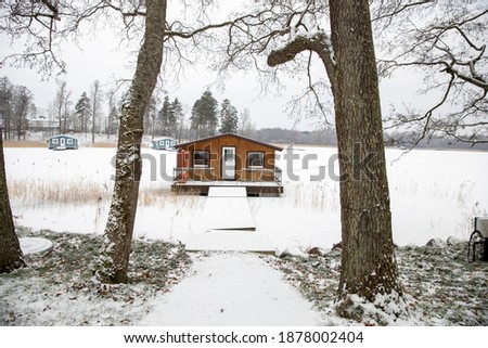 A tree house in the village in winter