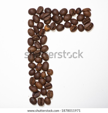 Russian Symbol U, the letter of an aphovite made of coffee. Coffee background, letter U.