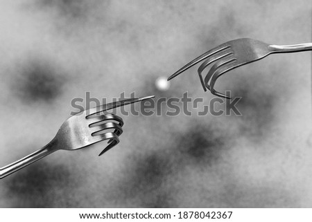               two forks with spark on gray   background  funny concept creation of adam
               Royalty-Free Stock Photo #1878042367