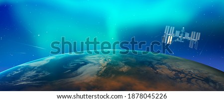 Northern lights aurora borealis over planet Earth with International Space Station  "Elements of this image furnished by NASA"