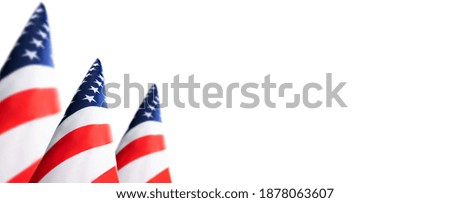 Stars and stripes. Close-up of American flags on white background.