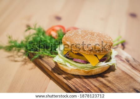 Chicken Cheese Burger on Wooden Background with Copy Space on top