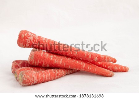 Best Quality Selected Red And Orange Carrots Stacked Together Or Decorated In Style And Isolated On White background With Blank Copy Space For Custom Text