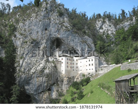 Predjama Castle is one of the oldest and most famous castles in Slovenia. Scenic view for souvenir postcard.