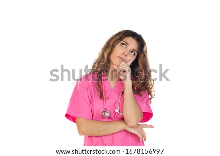 Attractive doctor wearing a pink uniform isolated on a white background