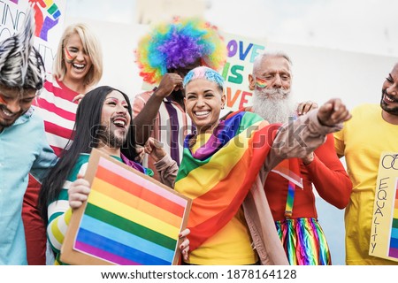 People from different generations have fun at gay pride parade with banner - Lgbt and homosexual love concept Royalty-Free Stock Photo #1878164128