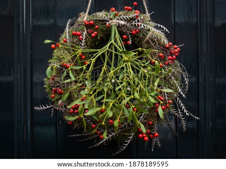 Traditional christmas wreath with mistletoe