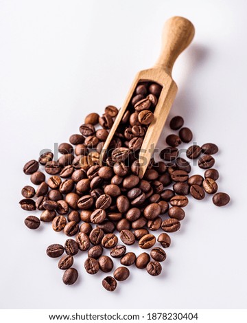 aromatic fresh coffee beans on a white acrylic background