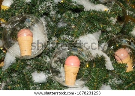 Close-up of a Christmas tree with ice cream balls . Christmas background.