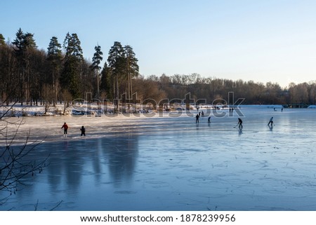 Ice skating on the first ice on the Talka river in Ivanovo, Russia.