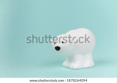 Little igushka white northern bear on a blank colored background with revenge for text