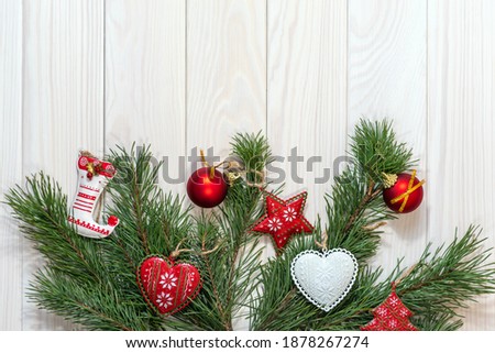 Macro, horizontal photo. Branches of a Christmas tree, New Year's decor on a light wooden background. Design for postcards, place for text. Kyiv (Kiev), Ukraine, Europe.