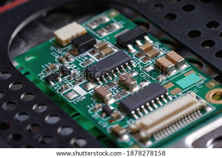 Small electronics module inside a laptop under repair Royalty-Free Stock Photo #1878278158