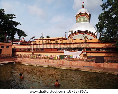 Bathing in Kalighat Kali Temple Kolkata India  Royalty-Free Stock Photo #1878279571