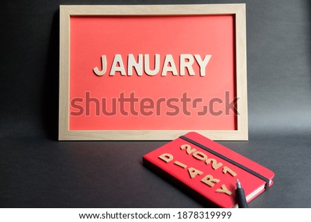 hello january word or  text on frame and diary. Concept for art, anniversary, calender and year.