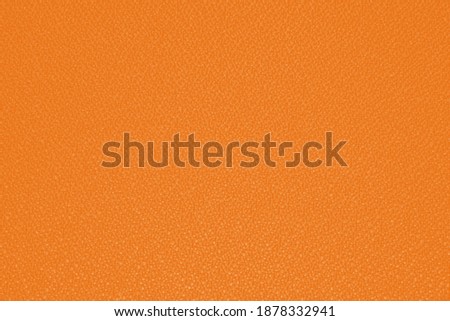 A blurry orange fabric abstract wallpaper