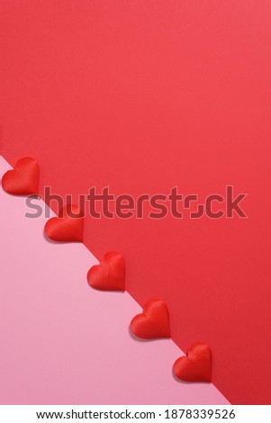 valentine's day greeting card layout with red hearts on pink and red background, for text place. festive wedding background.
