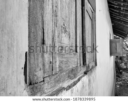 Old window made of wood and in the photo from the side, given a black and white effect