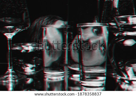 surreal portrait of a man looking through glasses of water with mirror reflections and distortions. Black and white with 3D glitch virtual reality effect
