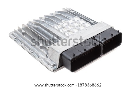 Metallic car engine control unit with plastic elements on a white isolated background is connecting center of various subsystems, units and assemblies. Monitoring the state of the moment. Spare part
