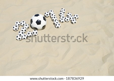 Soccer 2014 made with football soccer balls on beach in Rio de Janeiro Brazil