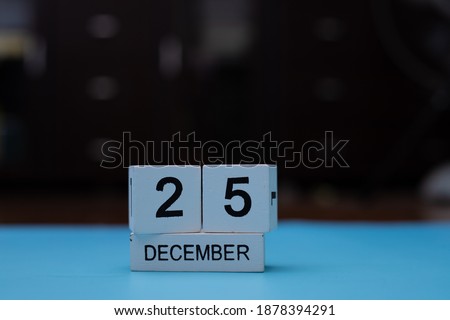 December 25, White vintage wooden calendar design with number cube.