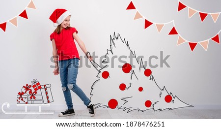 Little girl carrying sketch of christmas tree
