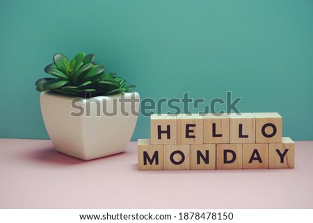 Hello Monday alphabet letter on blue and pink background