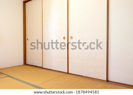 Japanese-style room with tatami mat and fusuma Royalty-Free Stock Photo #1878494581