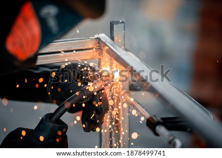 Low light rack welding , close up Royalty-Free Stock Photo #1878499741