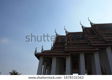 Another side of Wat Suthat Thepwararam with blue clear sky background, Bangkok Thailand. 