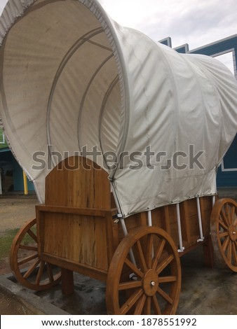 four-wheeled passenger cart and driven by horse