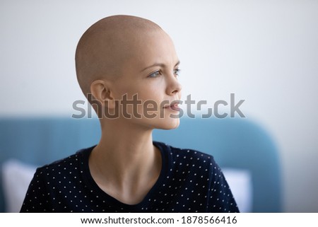 Ready to fight for life. Thoughtful sick young woman with light smile look aside planning struggle with cancer. Pensive hairless female oncology patient dream of happy future after defeating disease