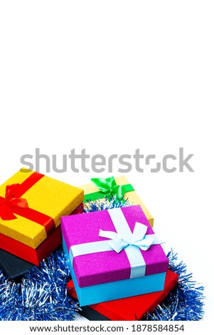 Celebration Concepts. Bunch of Colorful Wrapped Up Gift Boxes Placed In Line Against White Background. Vertical Image Composition