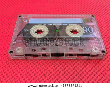 old cassette tape recorder, made of plastic with a tape to save sound