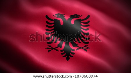 Close up waving flag of Albania. Flag symbols of Albania.