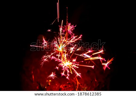 Firework, sparklers and bokeh lights on dark blue background
