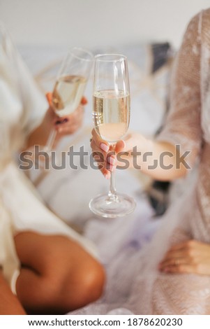 Champagne in a glass. Girls drink champagne. Festive mood. Bachelorette party. Royalty-Free Stock Photo #1878620230
