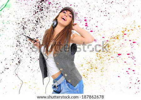 Girl Listening to Music over graffiti background