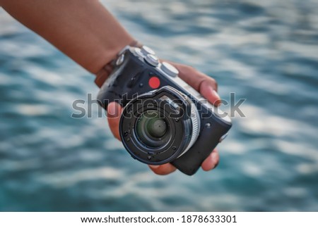 Waterproof underwater professional camera. Hand holding camera