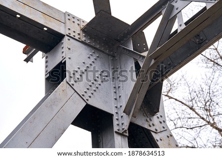 a fragment of an iron bridge against the sky                             