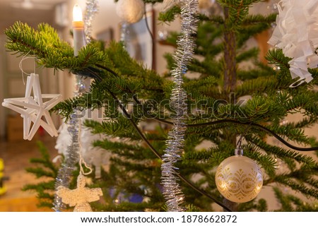 Close up of Christmas tree with Christmas baubles and Christmas tree glitter, picture from Vasternorrland Sweden.