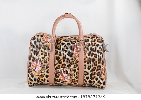Leopard printed bag with straps. Good fashionable and stylish bags. Multiple chambers inside and outside. 