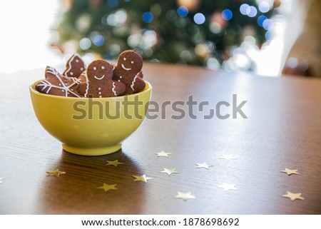 Christmas gingerbread bowl with bokeh lights background Royalty-Free Stock Photo #1878698692