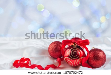 Group of red balloons on a white background.One ball with golden ornament.Red ribbon with bow.Copy space.