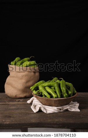 village green pepper on the wooden plate