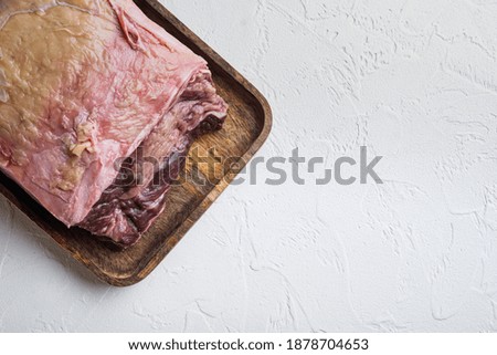 Striploin steak, raw beef butchery cut, on white background, top view, with copy space for text